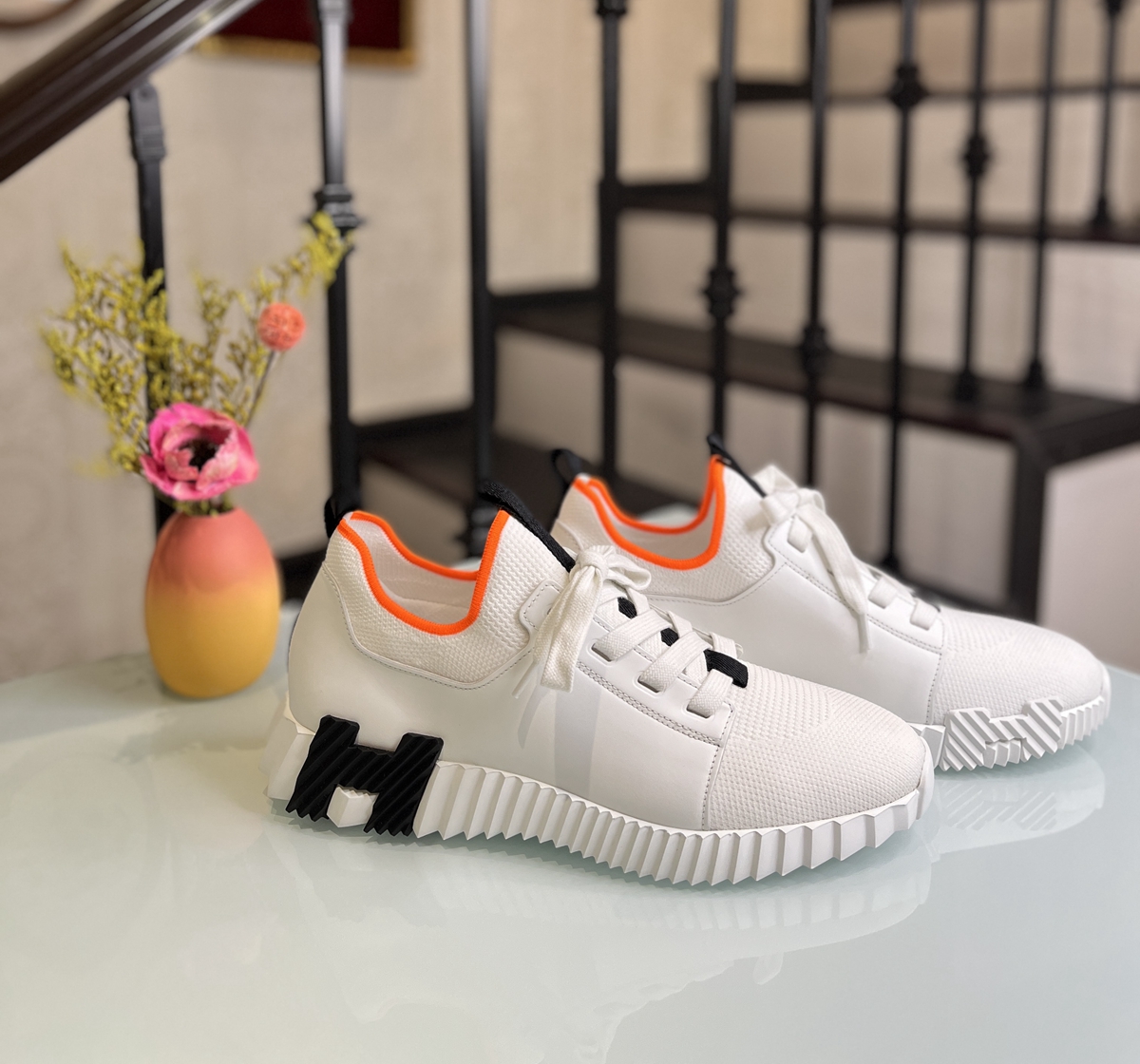 Men's shoes with white black label and orange trim